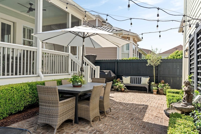 1527 Wando View St, Charleston, SC 29492 - view of patio / terrace with a fenced backyard, outdoor dining area, ceiling fan, and an outdoor living space