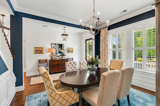 1527 Wando View St, Charleston, SC 29492 - dining area with crown molding, dark wood finished floors, a chandelier, stairs, and baseboards