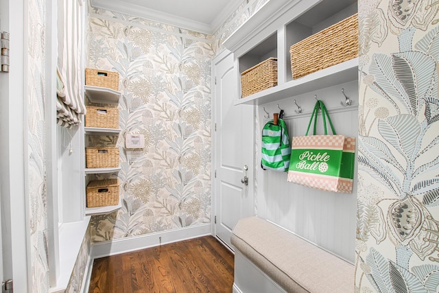 mudroom with baseboards, ornamental molding, wallpapered walls, and wood finished floors