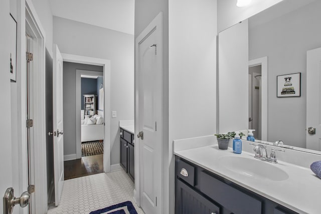 bathroom with vanity and connected bathroom