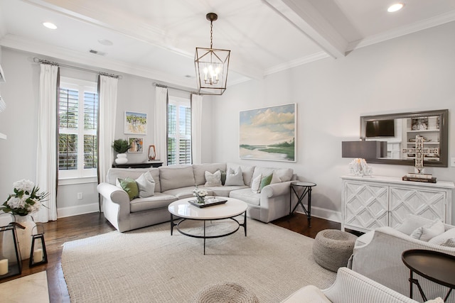 living room with visible vents, baseboards, wood finished floors, and a chandelier