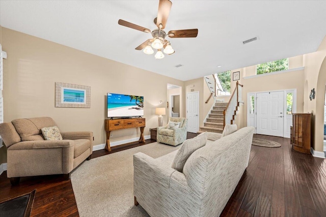 living room with ceiling fan and dark hardwood / wood-style floors