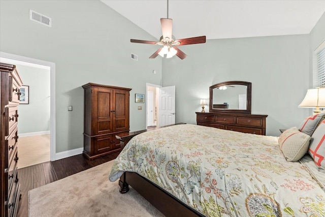 bedroom with ceiling fan, dark hardwood / wood-style floors, and high vaulted ceiling