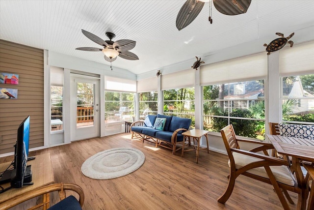 sunroom / solarium featuring ceiling fan