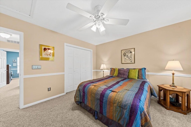 bedroom with light carpet, a closet, and ceiling fan