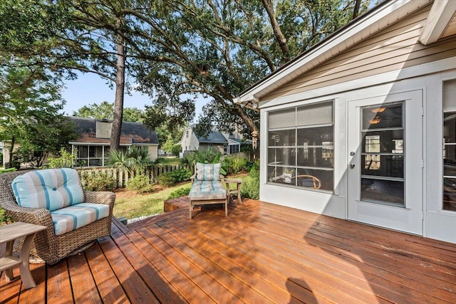 wooden deck featuring a sunroom