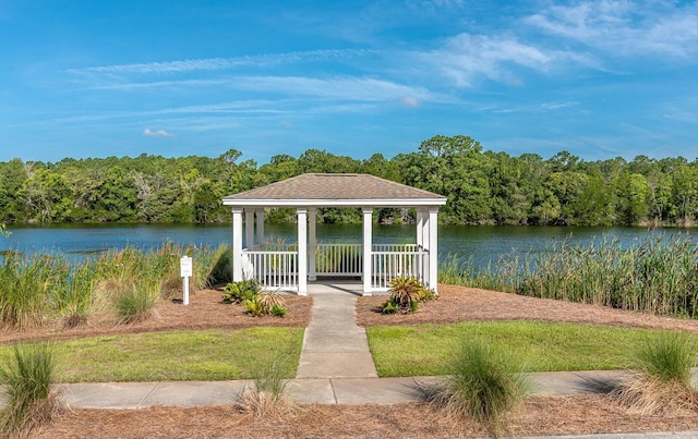 view of dock with a gazebo and a water view