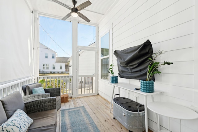 sunroom / solarium with ceiling fan