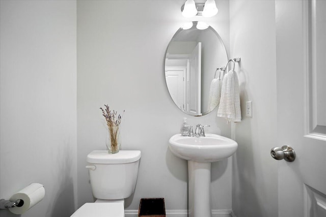 bathroom with toilet and sink