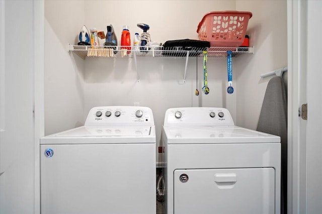 washroom with washing machine and dryer