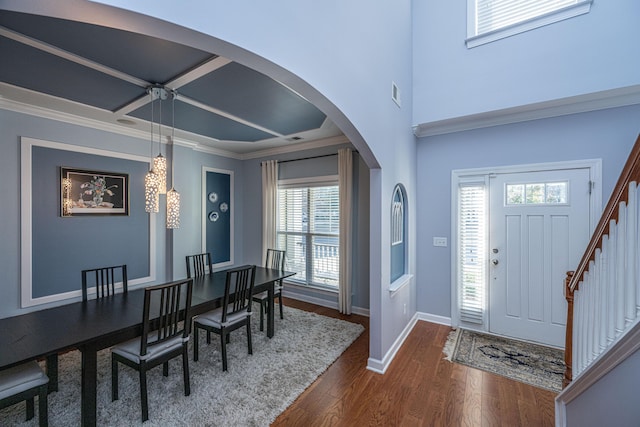 entryway featuring dark hardwood / wood-style floors and ornamental molding