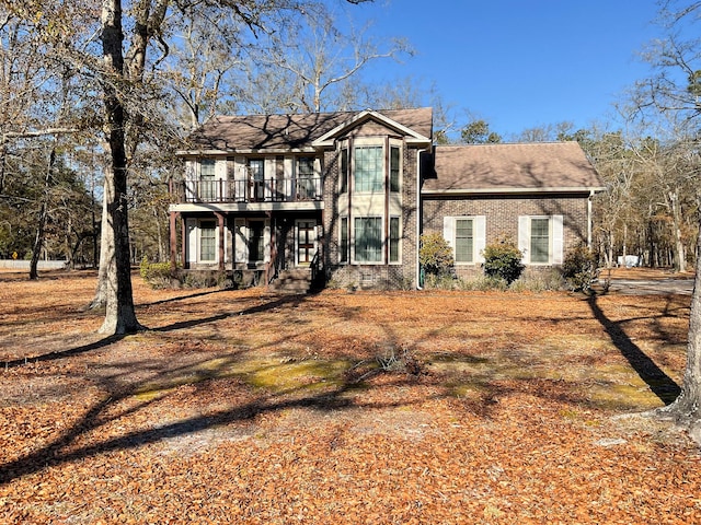 view of front of house with brick siding