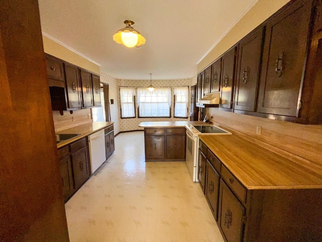 kitchen featuring under cabinet range hood, a peninsula, white appliances, dark brown cabinets, and wallpapered walls