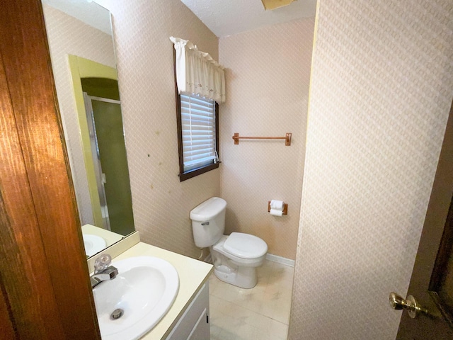 full bath with wallpapered walls, toilet, a stall shower, vanity, and tile patterned floors