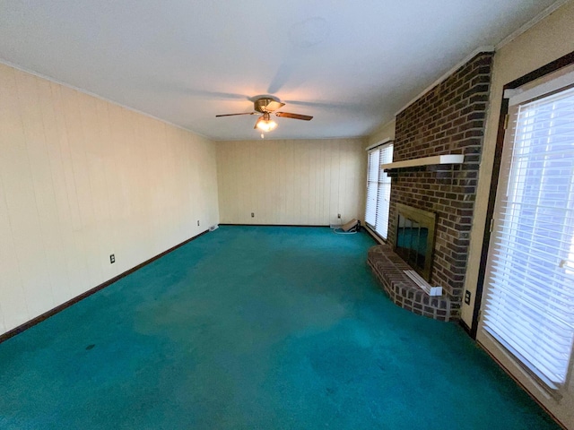 unfurnished living room with carpet, a fireplace, and ceiling fan