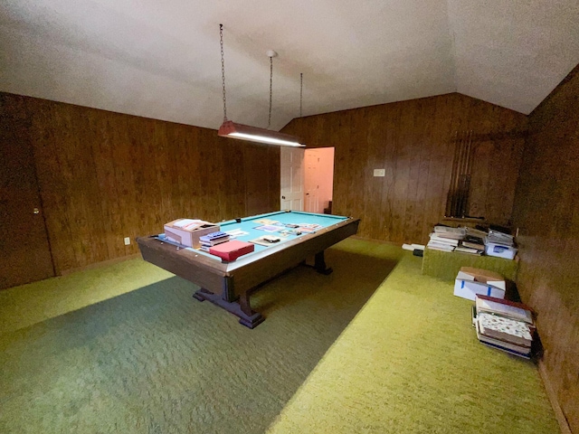 game room with lofted ceiling, wood walls, and carpet