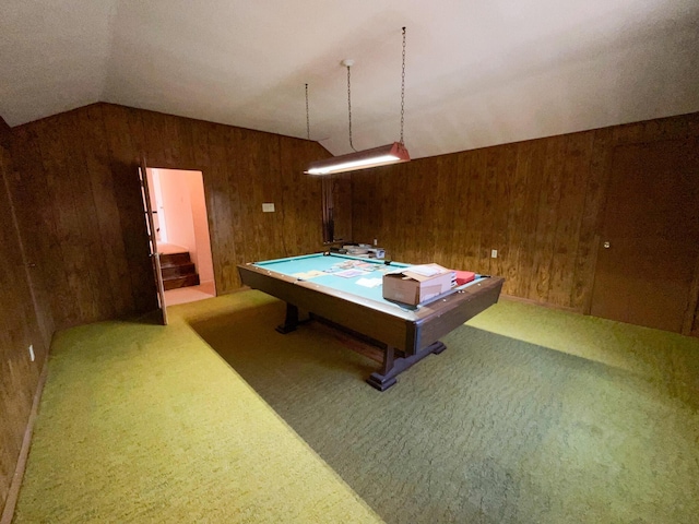 game room with vaulted ceiling, carpet flooring, and wood walls