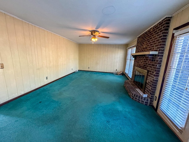 unfurnished living room featuring carpet floors, ceiling fan, and a fireplace