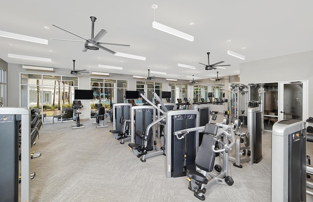 exercise room featuring ceiling fan and light colored carpet