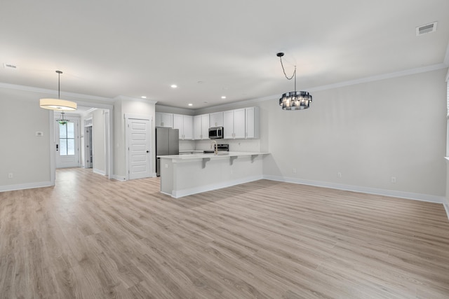 5133 Park Creek Ave, North Charleston, SC 29418 - unfurnished living room featuring ornamental molding, baseboards, light wood finished floors, a chandelier, and recessed lighting