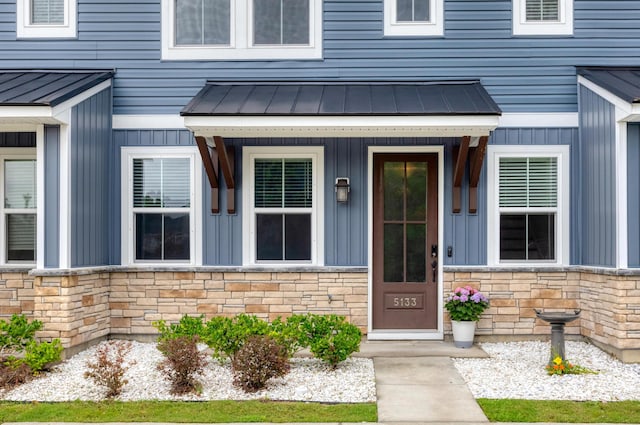 5133 Park Creek Ave, North Charleston, SC 29418 - doorway to property with stone siding, metal roof, board and batten siding, and a standing seam roof