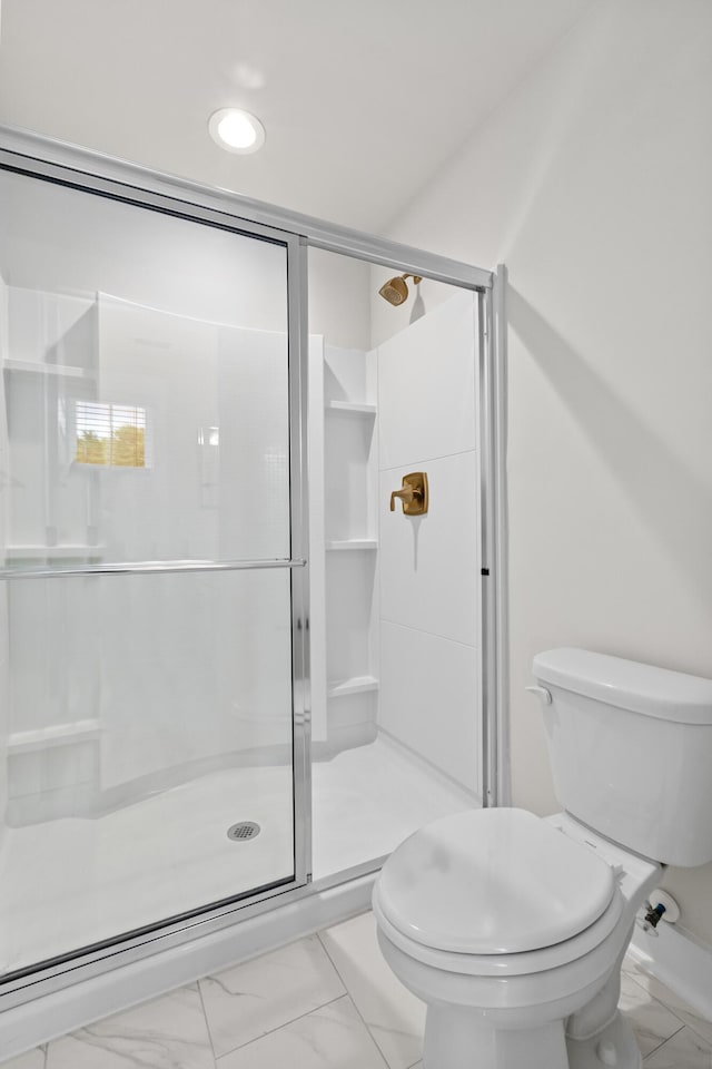 5133 Park Creek Ave, North Charleston, SC 29418 - bathroom with marble look tile flooring, toilet, and a stall shower