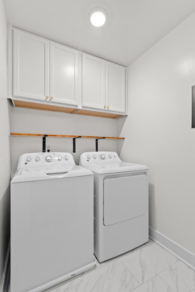 5133 Park Creek Ave, North Charleston, SC 29418 - washroom with cabinet space, washing machine and clothes dryer, baseboards, and light marble finish floors