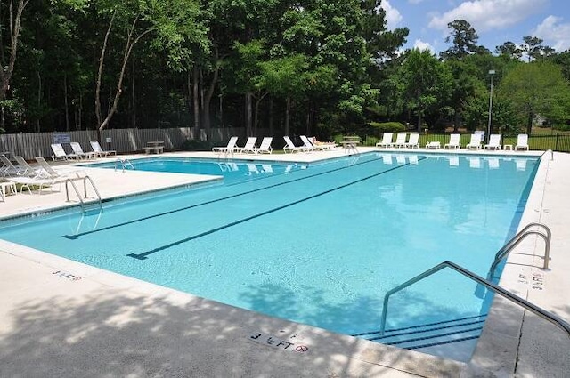 5133 Park Creek Ave, North Charleston, SC 29418 - community pool featuring a patio area and view of wooded area