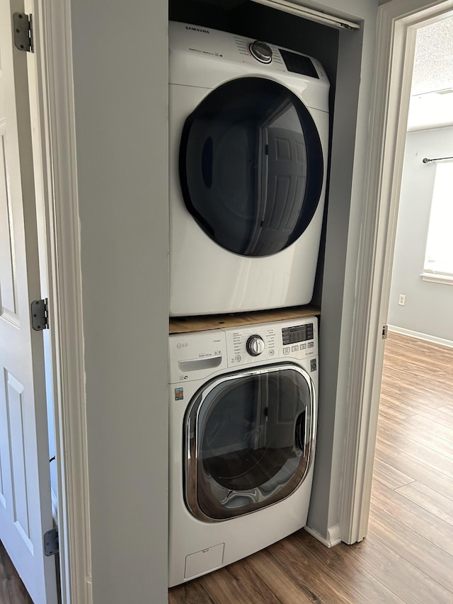 415 Parkdale Dr Unit 6D, Charleston, SC 29414 - laundry room with estacked washer and dryer and wood finished floors