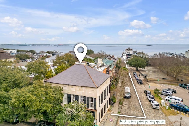 birds eye view of property with a water view