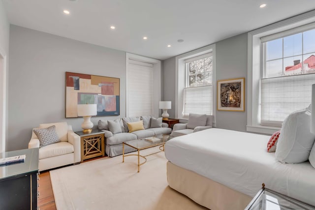 bedroom with wood finished floors and recessed lighting