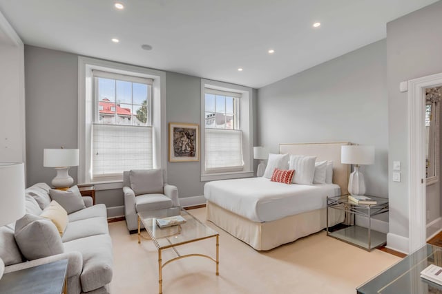 bedroom with light wood-type flooring, recessed lighting, and baseboards