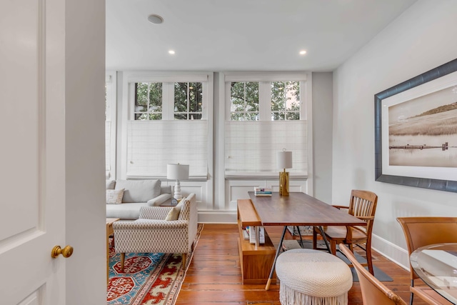 interior space featuring a healthy amount of sunlight, baseboards, wood finished floors, and recessed lighting