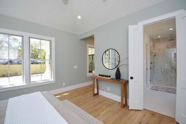 bedroom with recessed lighting, light wood-style floors, baseboards, and ensuite bathroom