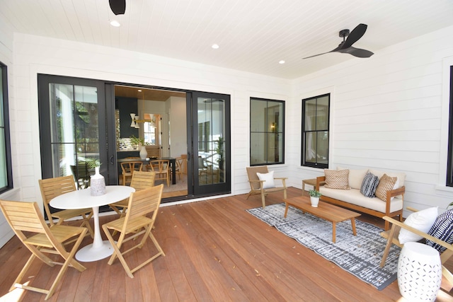 exterior space featuring wood ceiling and ceiling fan