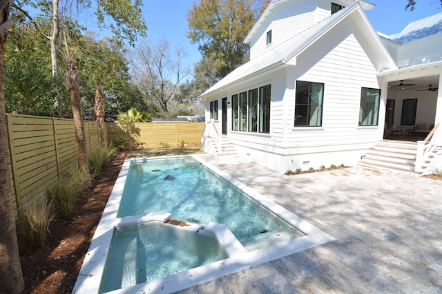 exterior space featuring a fenced backyard, a pool with connected hot tub, ceiling fan, crawl space, and a patio area