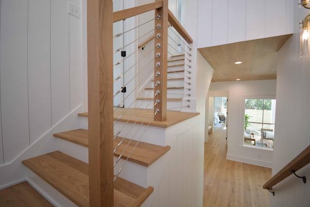 staircase featuring recessed lighting and wood finished floors