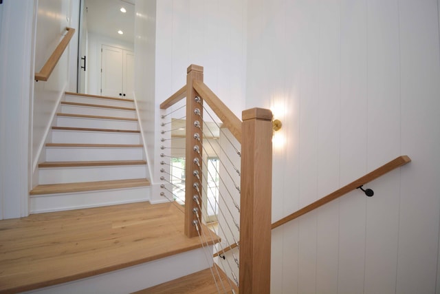 staircase with wood finished floors