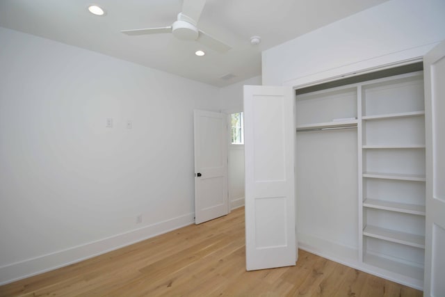 unfurnished bedroom featuring a closet, recessed lighting, baseboards, and light wood-style floors