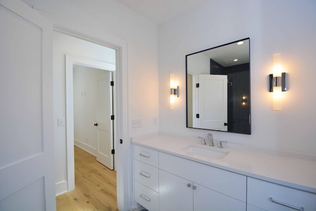 bathroom with vanity and wood finished floors