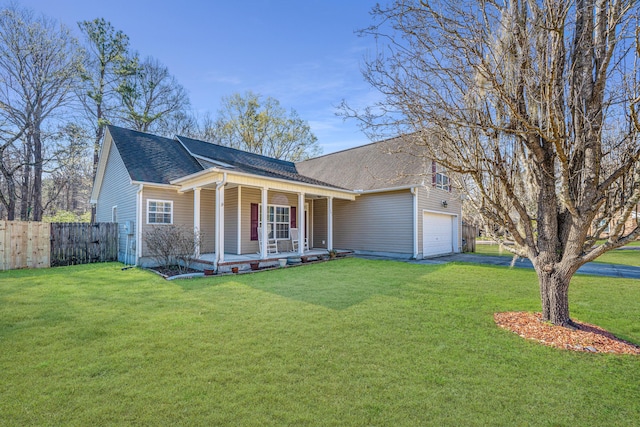 single story home featuring a garage, covered porch, and a front yard