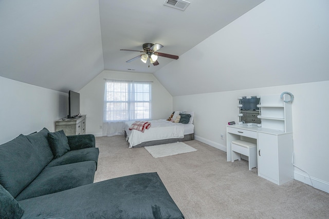 bedroom featuring light carpet, lofted ceiling, and ceiling fan