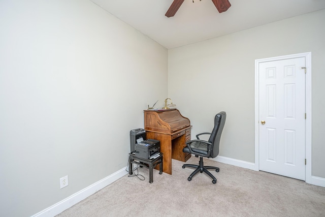 home office featuring ceiling fan and light colored carpet