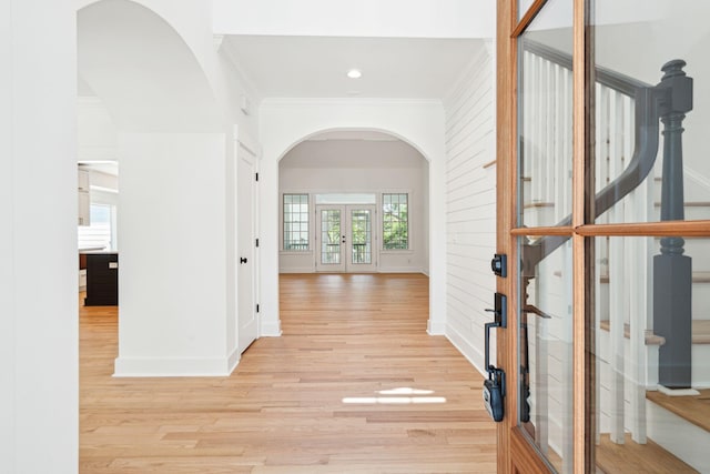 380 Tidal Reef Cir, Mount Pleasant, SC 29464 - foyer entrance with french doors, arched walkways, ornamental molding, light wood-style floors, and baseboards