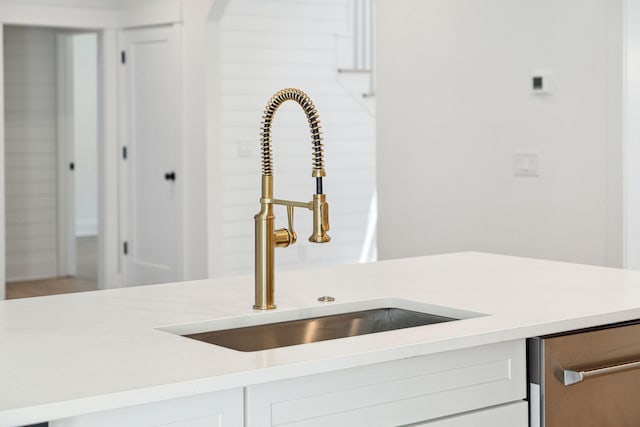 380 Tidal Reef Cir, Mount Pleasant, SC 29464 - kitchen view of a sink, light countertops, and white cabinetry
