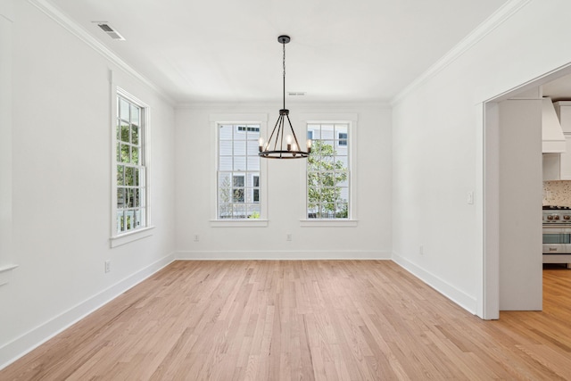 380 Tidal Reef Cir, Mount Pleasant, SC 29464 - unfurnished dining area featuring a chandelier, light wood finished floors, healthy amount of natural light, crown molding, and baseboards