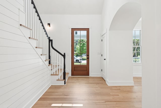 380 Tidal Reef Cir, Mount Pleasant, SC 29464 - entryway with light wood-type flooring, stairway, arched walkways, and baseboards