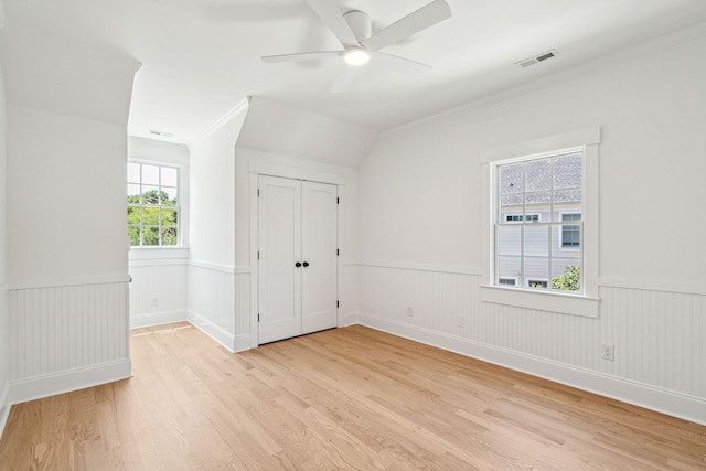 380 Tidal Reef Cir, Mount Pleasant, SC 29464 - spare room featuring wainscoting, light wood-type flooring, ceiling fan, and ornamental molding