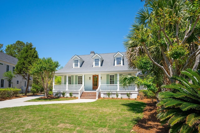 380 Tidal Reef Cir, Mount Pleasant, SC 29464 - cape cod house with a porch, a front lawn, a chimney, and a shingled roof