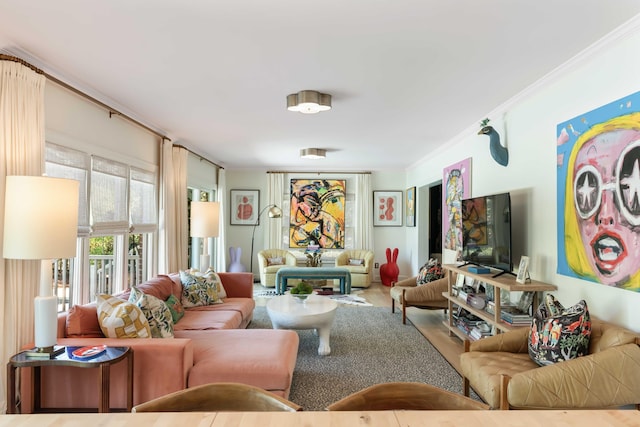 living room featuring crown molding and wood finished floors
